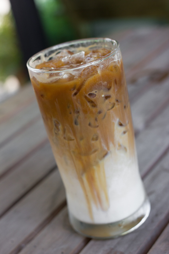 Iced coffee with milk is on the table.