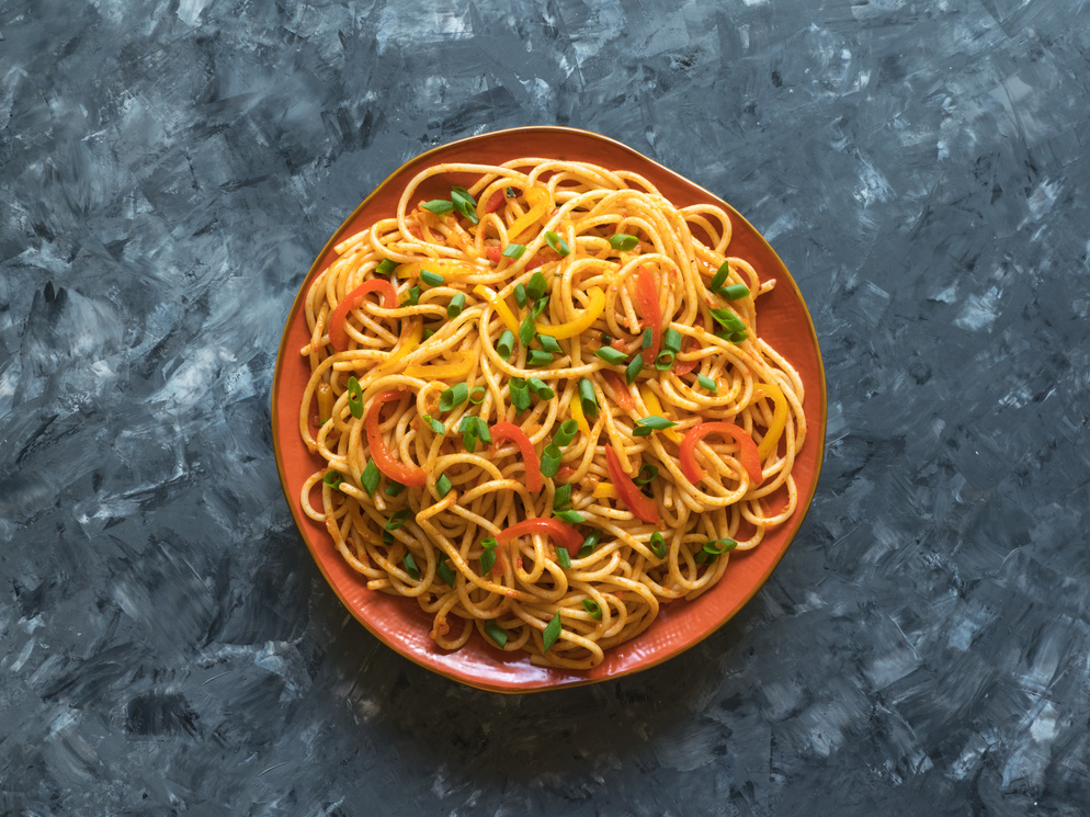 Schezwan hakka noodles. Served in a bowl. Top view